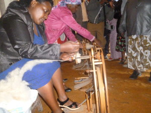 A woman spinning wool at Njabini Wool crafters Workshop -Kinangop, Nyandarua County.