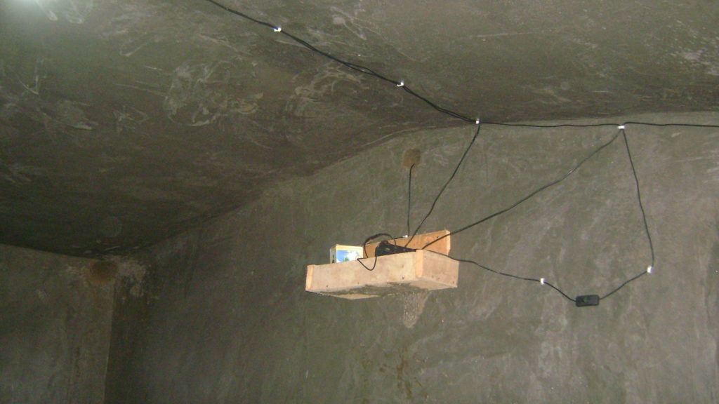 Inside the eco manyatta showing the solar charger for mobile phones