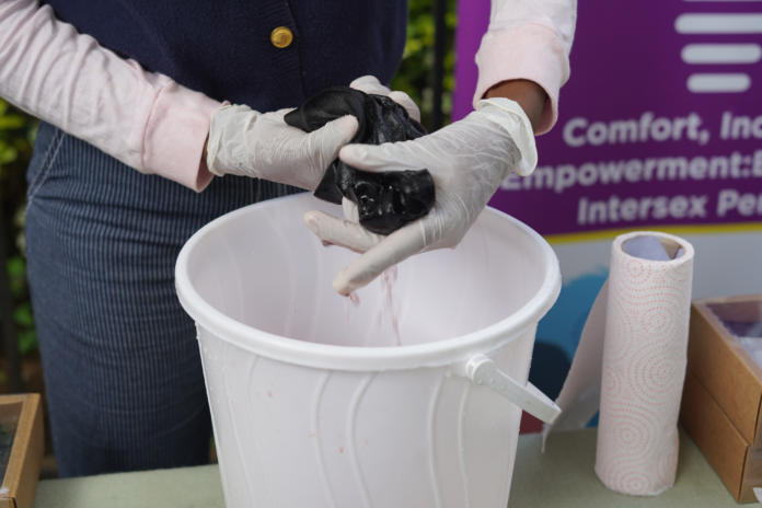 Irene Nyambura of Jinsiangu demonstrates how to clean the re-usable InclusiFit product PHOTO CYNTHIA NASAMBU